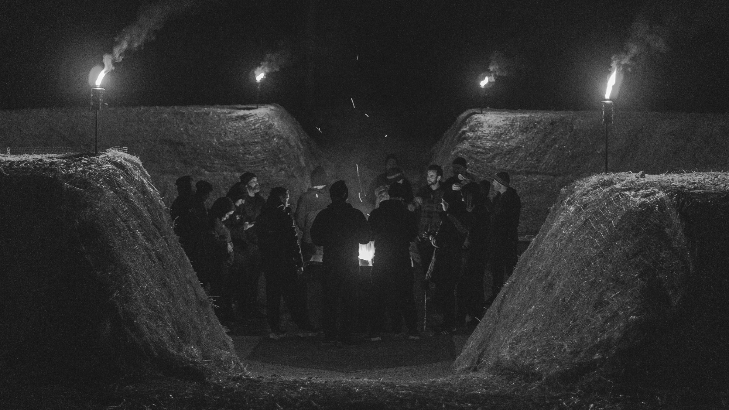 UHP class gathering around the fire inside SPACE