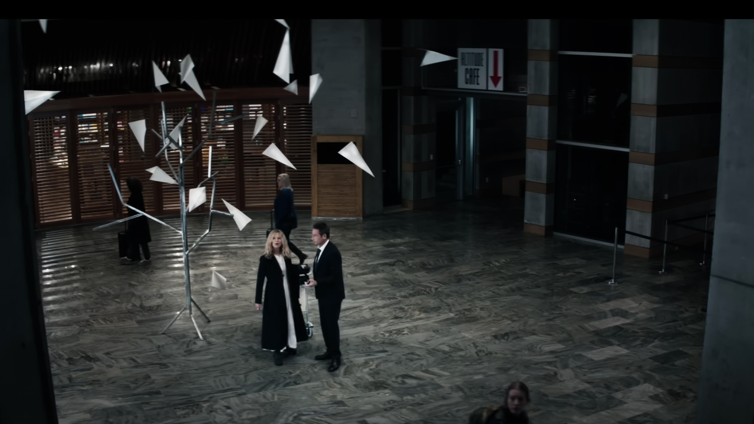 Wide film scene featuring the What Happens Later sculpture