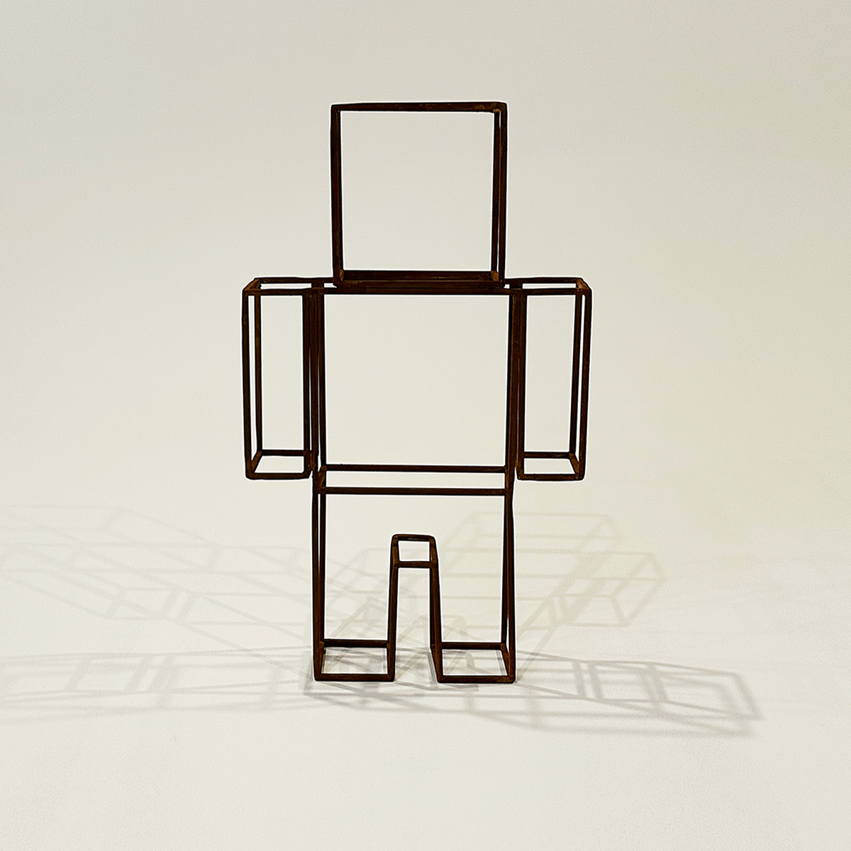 Front view of the FIGURE_1 MINI PATINA steel sculpture.